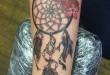 Traumfänger Blumen Tattoo am Arm